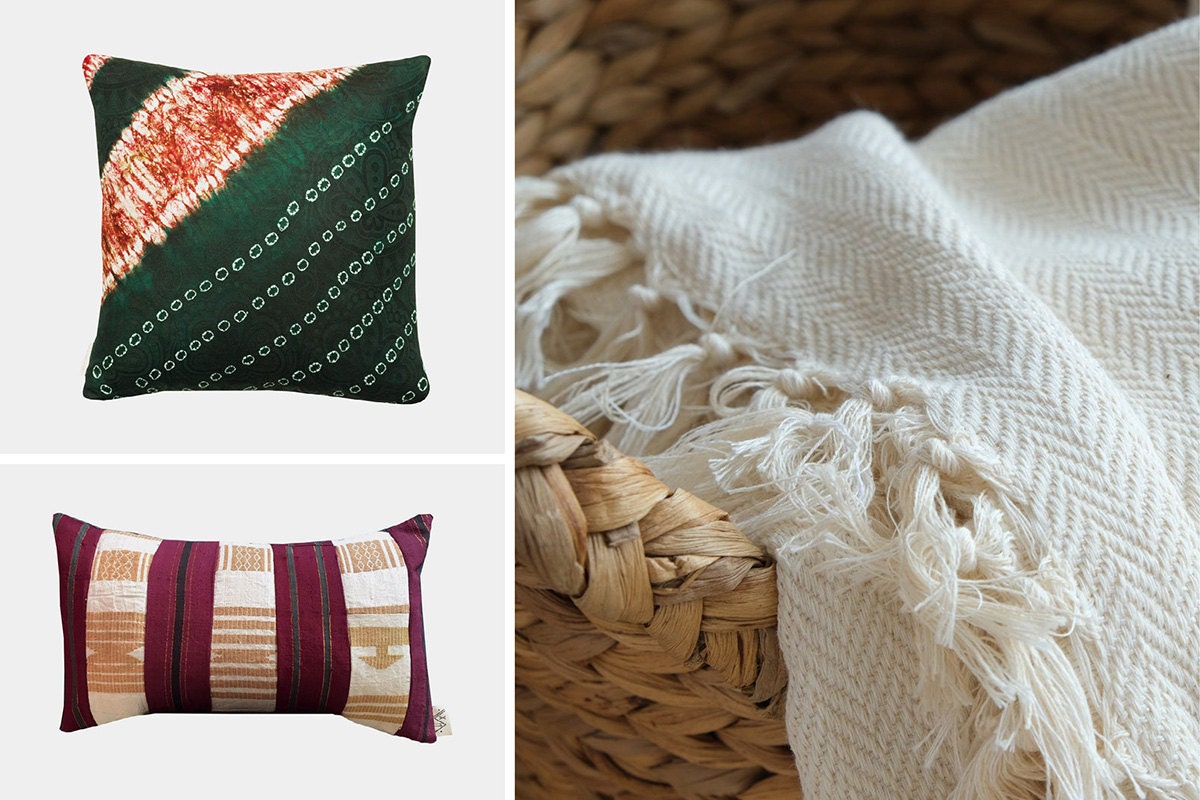 Two patterned pillows and a white cotton throw blanket