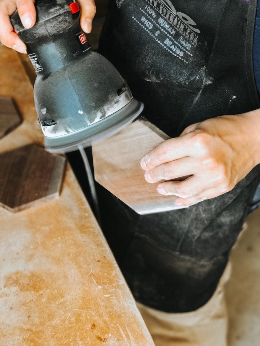 Wood being sanded in the CBYMCREATIVE workshop