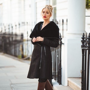 Cape hooded black shearling coat