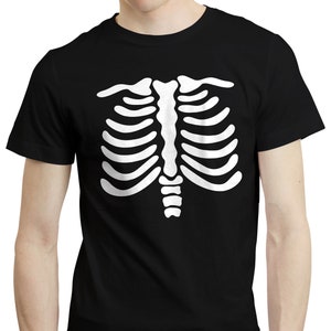 May include: Black t-shirt with a white skeleton rib cage design printed on the front. The graphic is a detailed representation of a human rib cage. The t-shirt has short sleeves and a round neck.