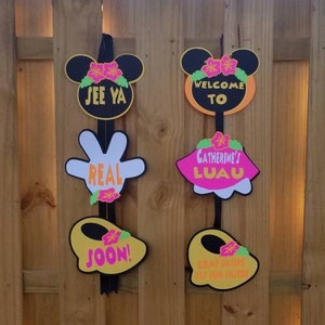 May include: A set of six colorful party signs featuring Mickey Mouse characters and the text "See Ya", "Welcome To", "Catherine's Luau", "Real", "Soon!" and "Come Join The Fun In The Sun!"