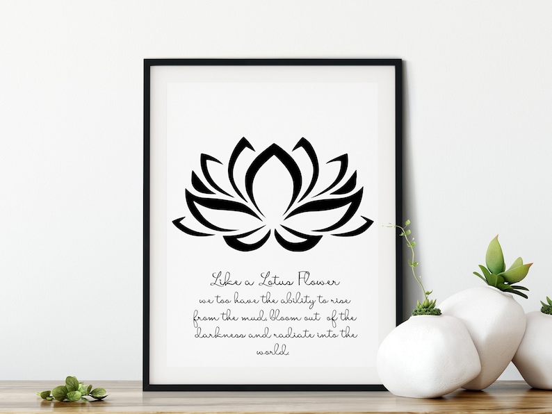 May include: Black and white printable wall art featuring a stylized lotus flower with the quote "Like a Lotus Flower we too have the ability to rise from the mud bloom out of the darkness and radiate into the world".