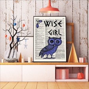 May include: A print of an owl with the words "Wise Girl" on a dictionary page background. The owl is blue and has large eyes. The background is a vintage dictionary page with text in black and white.