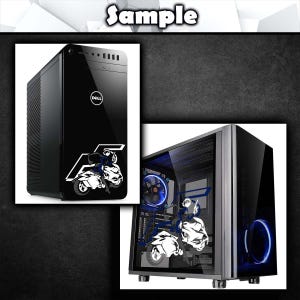 May include: A black computer tower with a white graphic of a person riding a motorcycle. The tower has a clear side panel that shows the inside of the computer, including a blue LED fan.