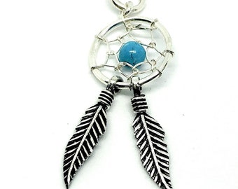 May include: Silver necklace with a turquoise dreamcatcher pendant and two silver feathers.