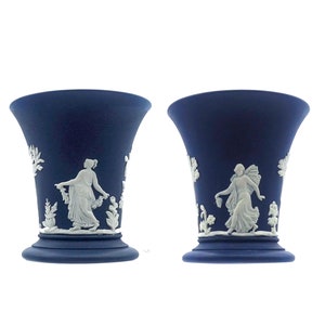 vintage Wedgwood pair of blue Jasperware candlesticks featuring the Dancing Hours