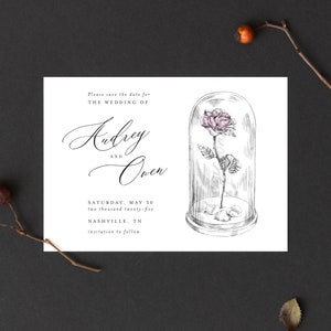 May include: Save the date card with a black and white illustration of a rose in a glass dome. The text reads "Please save the date for the wedding of Audrey and Owen, Saturday, May 30, two thousand twenty-five, Nashville, TN, invitation to follow."