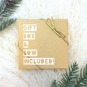 May include: A brown gift box with a gold ribbon and bow. The box has the text "GIFT BOX & BOW INCLUDED!" printed on it.
