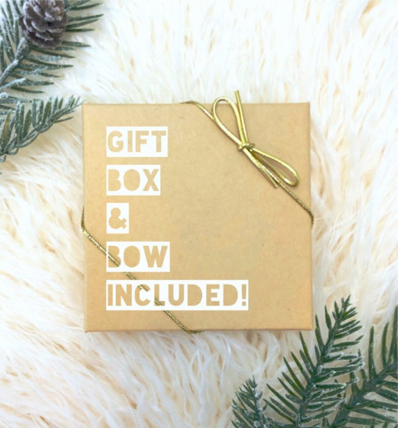 May include: A brown gift box with a gold ribbon and bow. The box has the text "GIFT BOX & BOW INCLUDED!" printed on it.