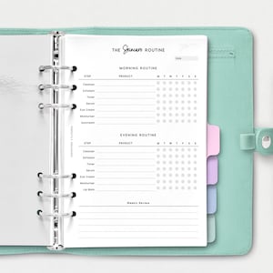 May include: A white printable skincare routine tracker with a black and white design. The tracker includes sections for morning and evening routines, with spaces to list products and check off days of the week. The tracker is in a binder with silver rings.