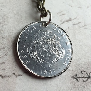 COSTA RICA coin pendent on a 24 inch chain necklace. BOGO Free - sellers choice