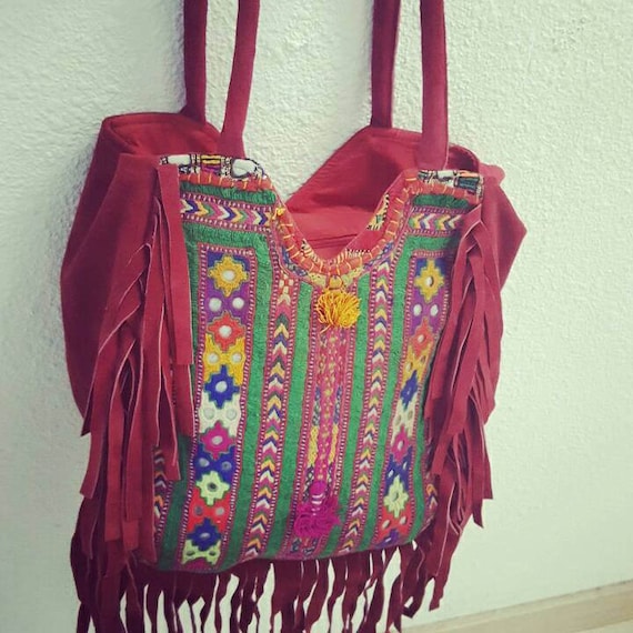 red suede bag with indian embroidery