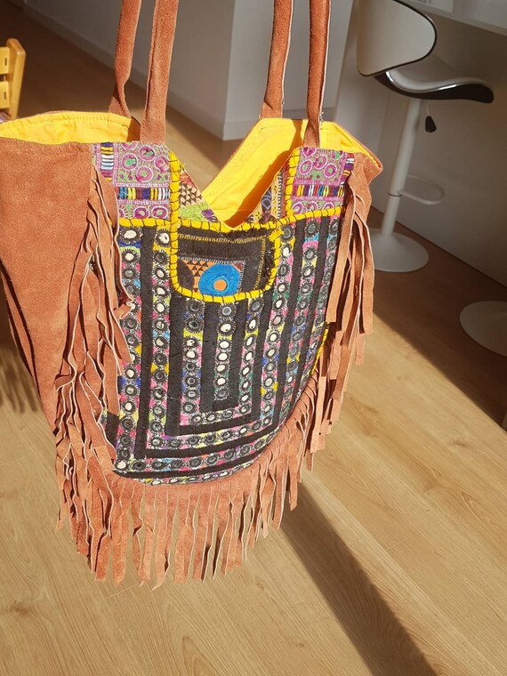 red suede bag with indian embroidery