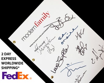 May include: A white script with the title "modern family" written in red. The script is signed by the cast and crew, including Steven Levitan and Christopher Lloyd. The script is for the pilot episode, which aired on September 23, 2009.