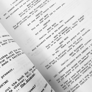 May include: A black and white photo of a script for a movie or play. The script is titled "DORMONT HOLLYWOOD MOVIE THEATER" and includes the names "Mary Elizabeth" and "Charlie".