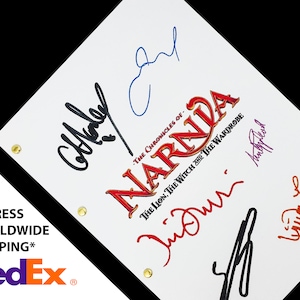 May include: A white script with the title "The Chronicles of Narnia: The Lion, The Witch and The Wardrobe" in red and orange lettering. The script is signed by five people in black, blue, red, orange, and purple ink.