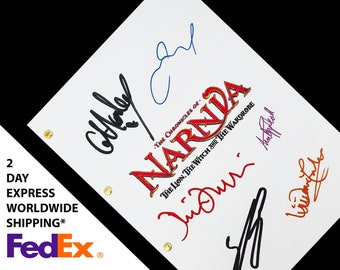 May include: A white script with the title "The Chronicles of Narnia: The Lion, The Witch and The Wardrobe" in red and orange lettering. The script is signed by five people in black, blue, red, orange, and purple ink.