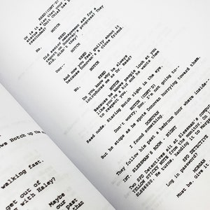 May include: A close-up of a script for a television show or movie. The script is printed on white paper and includes dialogue between two characters, Hotch and Reed. The dialogue is about a case and the characters are discussing the status of the case.