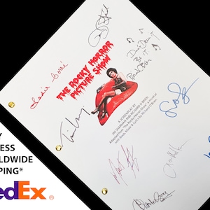 May include: A white script for the musical "The Rocky Horror Picture Show" with signatures from the cast, including Tim Curry, Susan Sarandon, and Richard O'Brien. The script features a red and black image of a pair of lips with a high heel shoe.