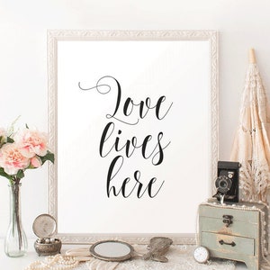 Printable Wall Art Love Quote print Love Lives Here Simple Black and White Quote Print Living Room Wall Decor Master Bedroom Art image 1