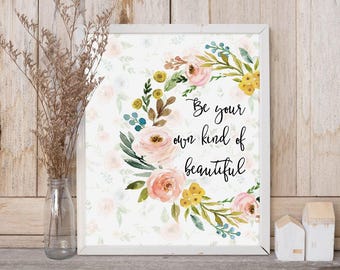 May include: White framed print with a watercolor floral wreath and the text "Be your own kind of beautiful".
