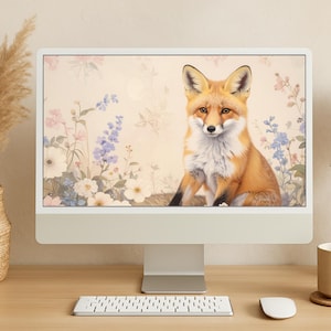 May include: A computer monitor displaying a digital illustration of a red fox sitting in a field of flowers. The fox has a white chest and a bushy tail. The flowers are a variety of colors, including pink, blue, and white.