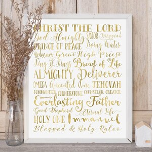May include: A white framed print with gold lettering on a white background. The print features a list of titles for Jesus Christ, including "Christ the Lord", "God Almighty", "Savior", "Messiah", "Prince of Peace", "Living Water", "Redeemer", "Great High Priest", "King of Kings", "Bread of Life", "Almighty", "Deliverer", "Omega", "Anointed One", "Jehovah", "Commander", "Cornerstone", "Counselor", "Creator", "Everlasting Father", "Good Shepherd", "Eternal Life", "Holy One", "Immanuel", "Blessed & Holy Ruler".