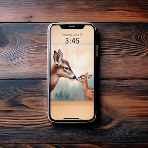 May include: A phone screen displaying a digital clock with the time 3:45 and the date Saturday, June 19. The background image features a brown and white deer with a fawn, both looking at each other.