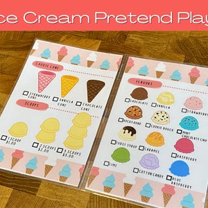 May include: Two laminated ice cream pretend play menus. The menus feature illustrations of ice cream cones and flavors, including strawberry, vanilla, and chocolate. The text "Ice Cream Pretend Play" is at the top.