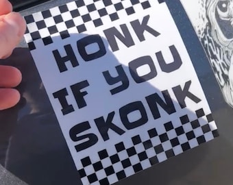 May include: A black and white checkered sticker with the text "HONK IF YOU SKONK" in black letters.