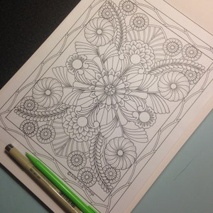 May include: A black and white coloring page featuring a detailed floral design with intricate patterns. The design is centered on a large flower with smaller flowers and leaves surrounding it. The page is titled "2016 C.L. Aldridge".