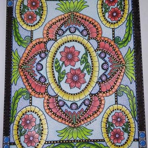 May include: A colorful, intricate mandala design with a blue background. The mandala features a central oval with two red flowers and green leaves, surrounded by a series of concentric circles and geometric patterns. The design is framed by a black border with a dotted line.