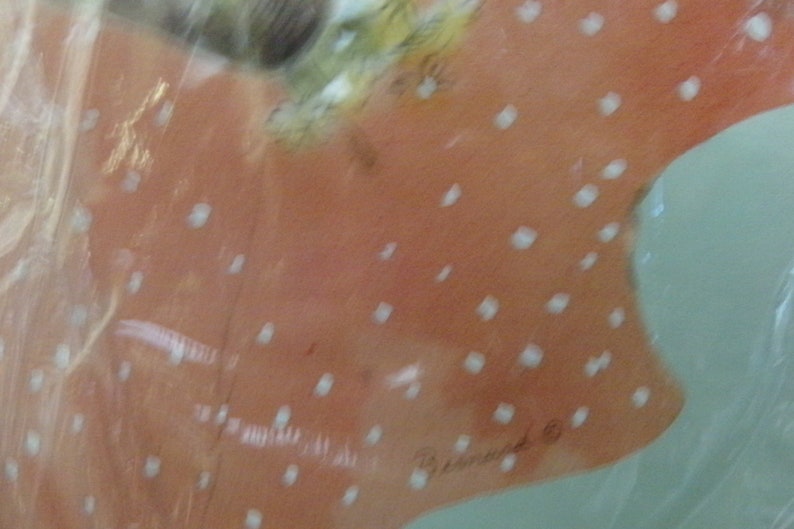 May include: A close-up of a pink and white patterned fabric with white polka dots. The fabric has a handwritten signature that says "Bessie Ward & Co."