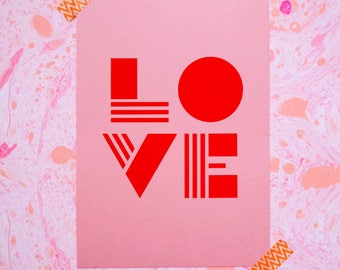 Typographic LOVE Risograph print on millennial pink paper with bold red letters