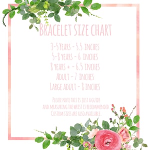 May include: A bracelet size chart with text in pink font, surrounded by a pink border and floral accents. The chart lists sizes for children and adults, ranging from 5.5 inches to 8 inches. The text also recommends measuring the wrist for accuracy.