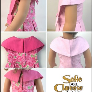 May include: A pink dress with a floral print and a large pink collar. The dress has a bow at the waist and short sleeves. The dress is designed for a doll. The image includes the text "Sofie Doll Claresse fashion".