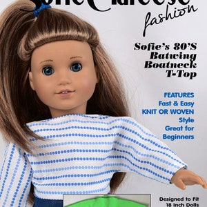 May include: A sewing pattern for a doll's 80's style batwing boatneck t-top. The pattern is designed to fit 18 inch dolls, such as American Girl dolls. The pattern is knit or woven and is described as fast and easy, great for beginners. The image shows a doll wearing a blue and white striped t-top.