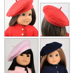 May include: Four different doll hats, including a red beret, a pink beret, a blue beret, and a red tam. The hats are all made of felt and have a simple design.