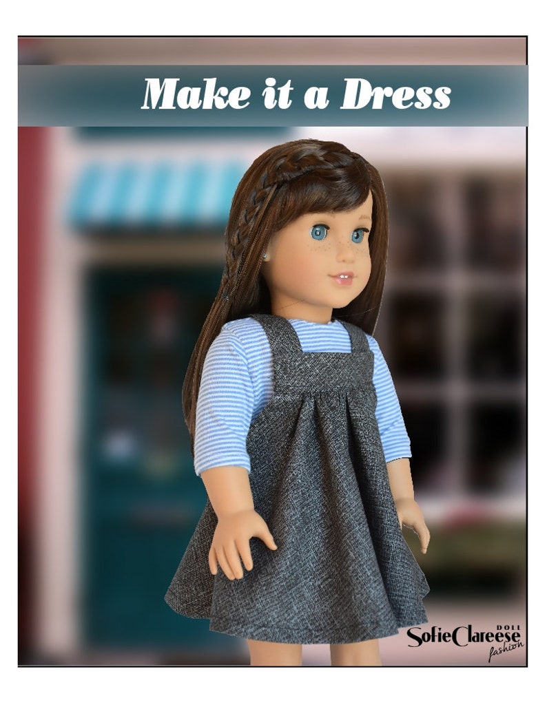 May include: A doll wearing a gray dress with a blue and white striped shirt underneath. The dress has a bib style top with straps. The doll has brown hair and blue eyes. The text "Make it a Dress" is at the top of the image. The text "SofieClareee Doll Fashion" is at the bottom of the image.