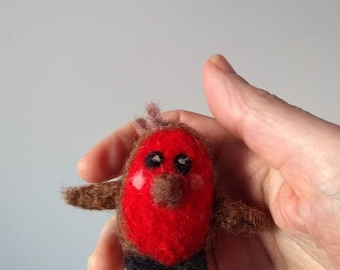 Little robin popping up to see if you have any fat balls!