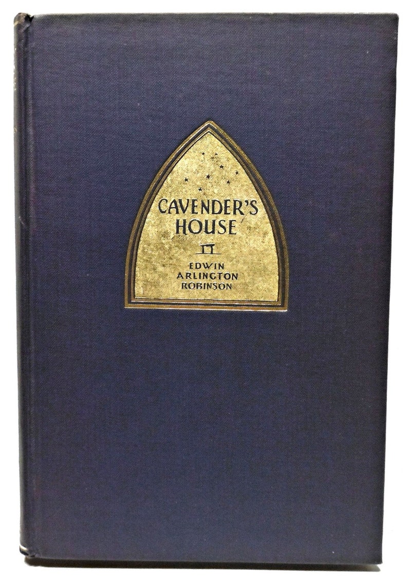 May include: A dark blue hardcover book with a gold-colored title on the front. The title reads "Cavender's House" by Edwin Arlington Robinson.