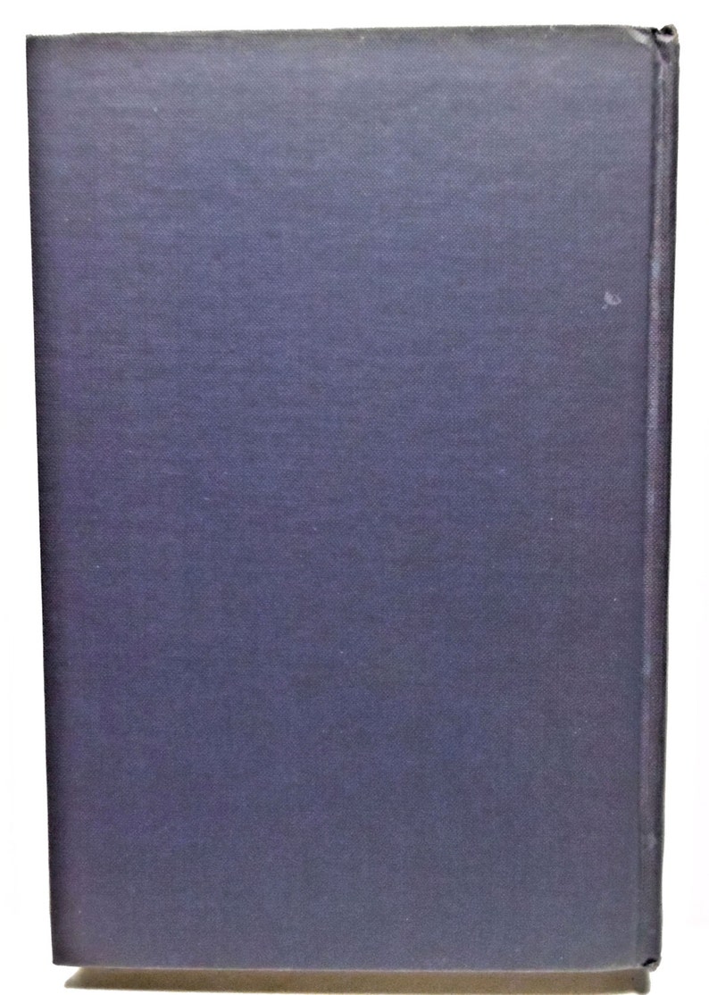May include: A dark blue hardcover book with a smooth, textured cover.