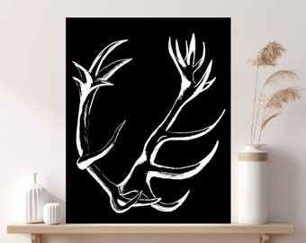 May include: A black and white illustration of a stylized antler design. The antler is depicted in a circular shape with intricate details.