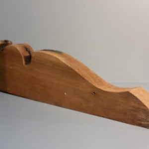 Architectural element unfinished wood template Sculpted corbel shape Found objects