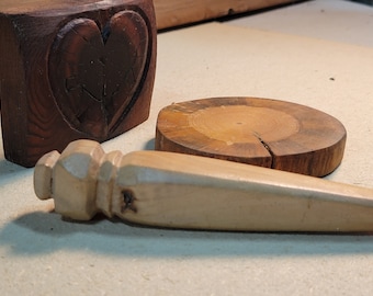 Found objects, wood handle, wood cookie coaster, heart shaped knot.