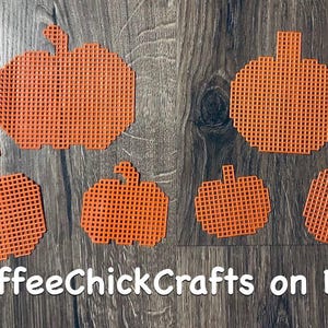 May include: Five orange plastic pumpkin shapes of varying sizes. The pumpkins are made of plastic canvas and are perfect for crafting.
