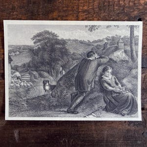 May include: A black and white engraving print depicting a rural landscape with a person leaning against a large rock and another person sitting nearby. A dog stands in the foreground, while a shepherd tends to a flock of sheep near a fence in the distance.