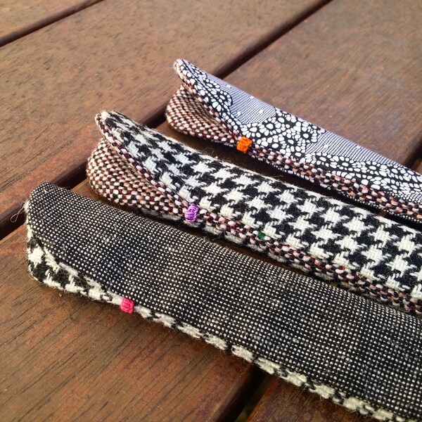 black and white Fountain Pen Sleeves handmade from Harris Tweed, cotton and wool fabrics for a single pen
