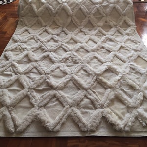Patchwork cowhide & sheepskin rug. Mix of whites. 5’ x 10’ Model Diamond 1