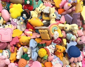 May include: A large assortment of colorful resin charms featuring various cute designs, including animals, food, and other whimsical shapes. The charms are perfect for adding a touch of personality to jewelry, keychains, and other crafts.
